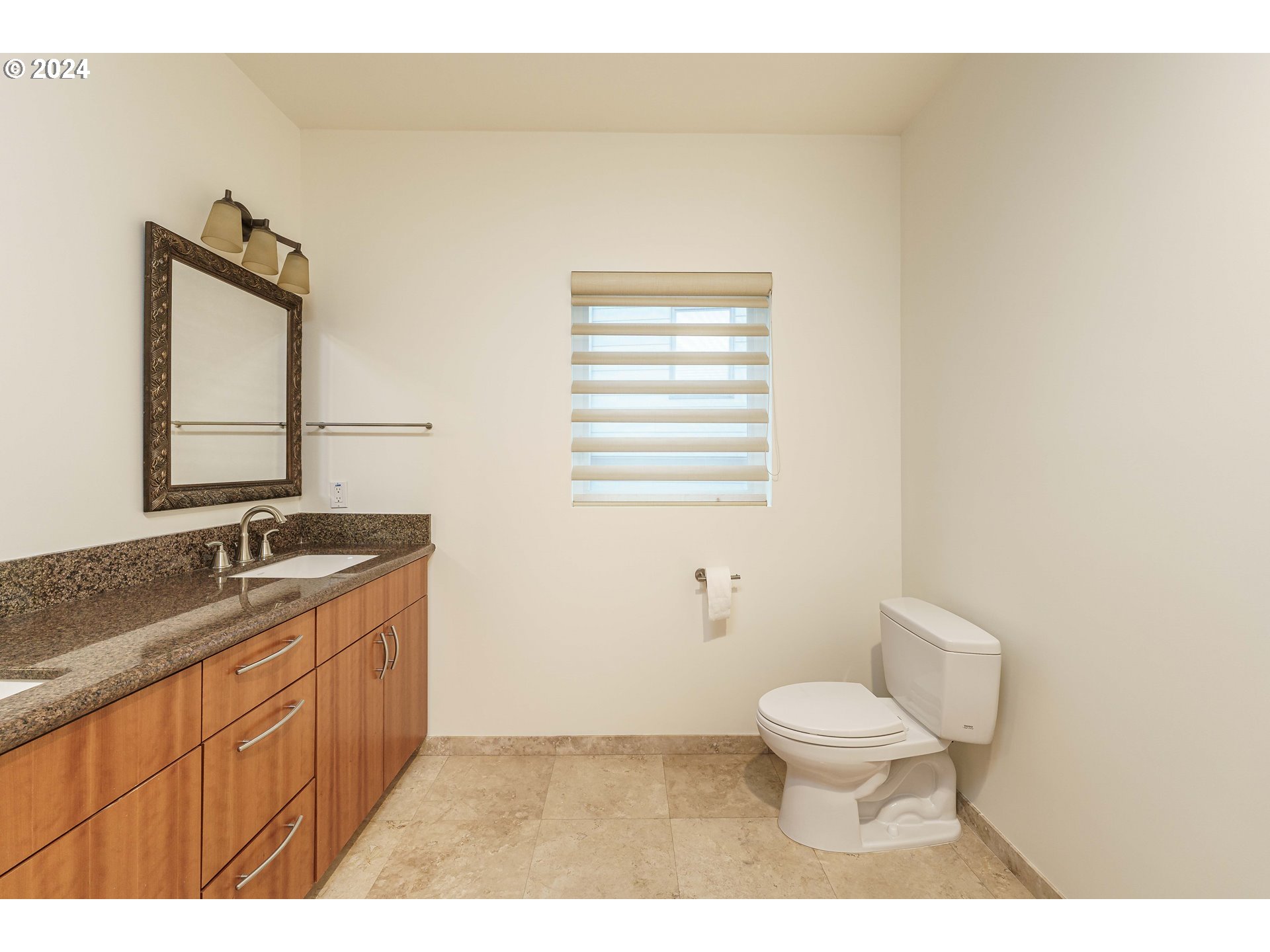 3030 Northwest Montara Loop Portland, OR 97229 - Photo 27 of 37 a bathroom with a granite countertop toilet a sink and a mirror