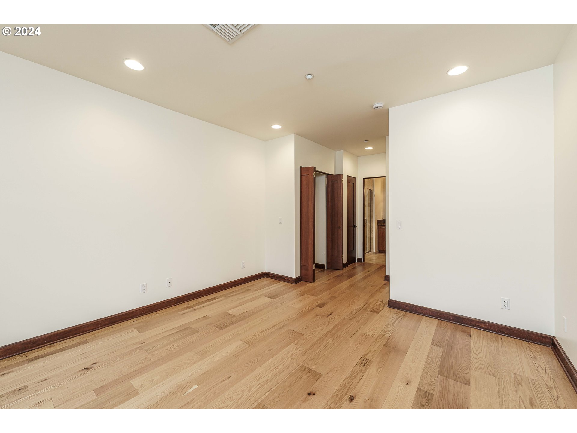 3030 Northwest Montara Loop Portland, OR 97229 - Photo 31 of 37 a view of an empty room with wooden floor