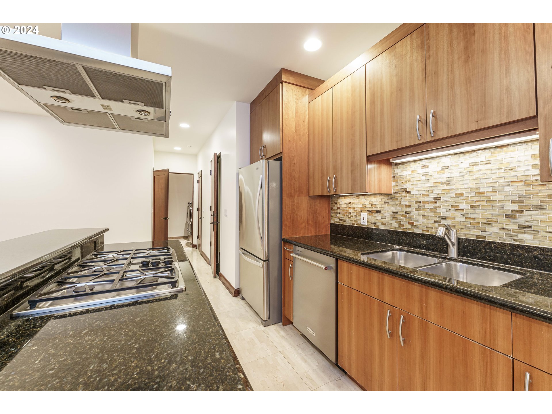 3030 Northwest Montara Loop Portland, OR 97229 - Photo 9 of 37 a kitchen with granite countertop a sink and a refrigerator