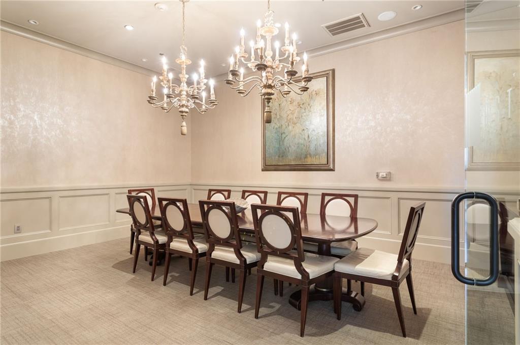 2255 Peachtree Road Northeast, Unit 326 Atlanta, GA 30309 - Photo 33 of 37 a view of a dining room with furniture and chandelier