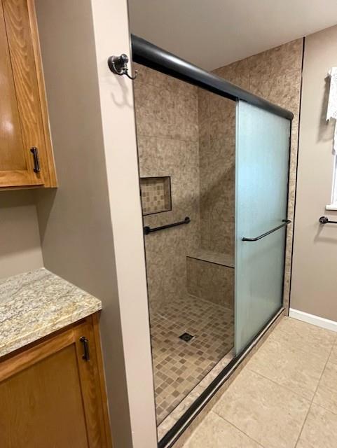 119 East Clausen Road Turlock, CA 95380 - Photo 11 of 26 a bathroom with a granite countertop shower and a sink