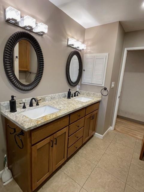 119 East Clausen Road Turlock, CA 95380 - Photo 12 of 26 a bathroom with a granite countertop double vanity sink and a mirror