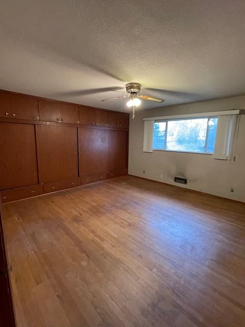 119 East Clausen Road Turlock, CA 95380 - Photo 14 of 26 an empty room with wooden floor and windows