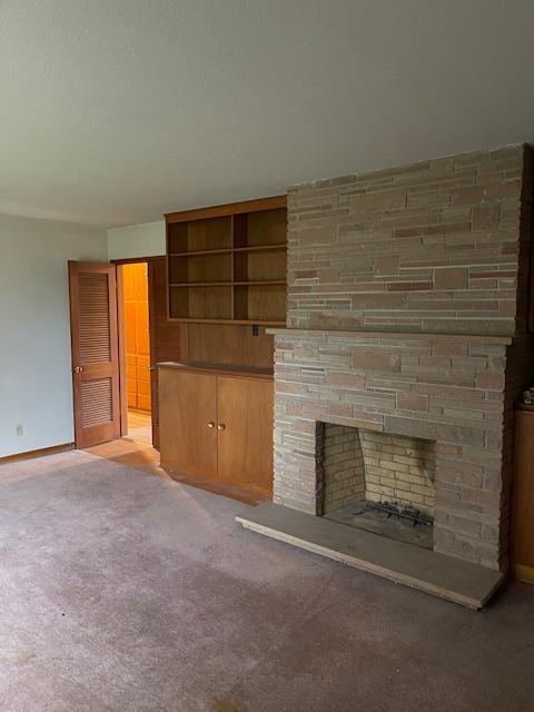 119 East Clausen Road Turlock, CA 95380 - Photo 15 of 26 an empty room with a fireplace and window