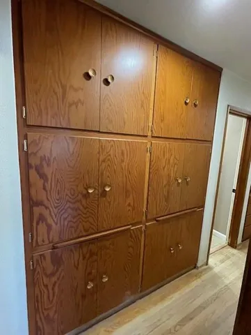 a view of an empty room with glass door