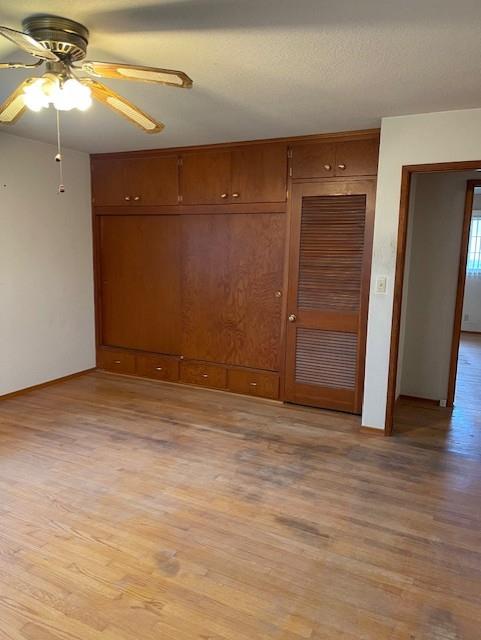 119 East Clausen Road Turlock, CA 95380 - Photo 20 of 26 a view of an empty room with wooden floor and a ceiling fan