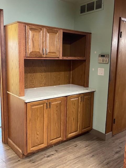 119 East Clausen Road Turlock, CA 95380 - Photo 8 of 26 a view of kitchen with wooden floor and cabinets