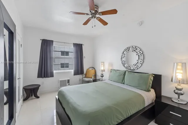 a bedroom with bed and window