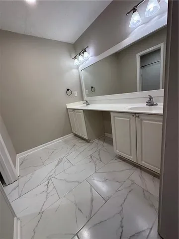 a bathroom with a toilet a sink and bathtub