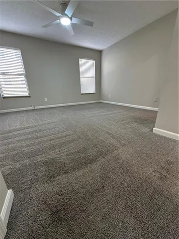 a spacious bathroom with a double vanity sink and a mirror