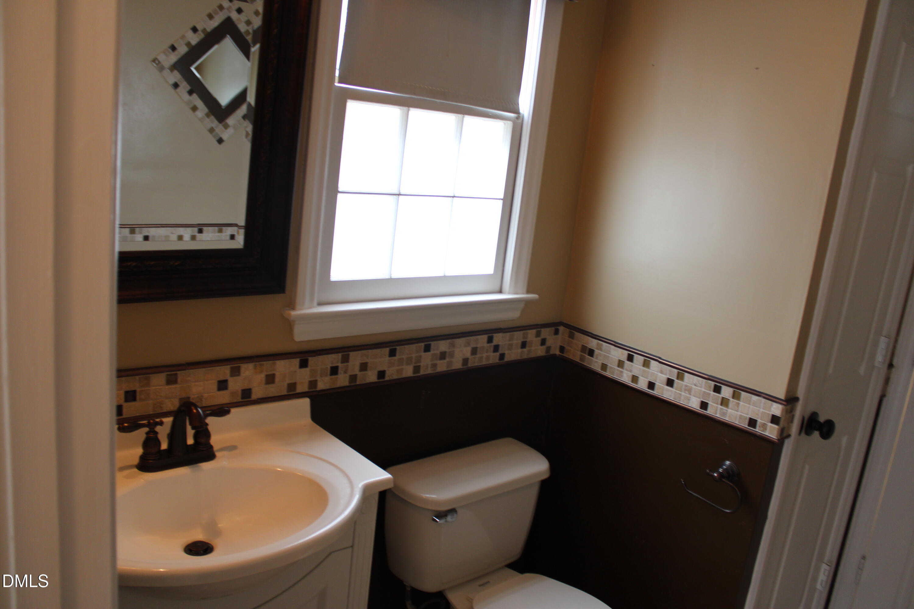 6701 Queen Annes Drive Raleigh, NC 27613 - Photo 13 of 23 a bathroom with a sink and a toilet