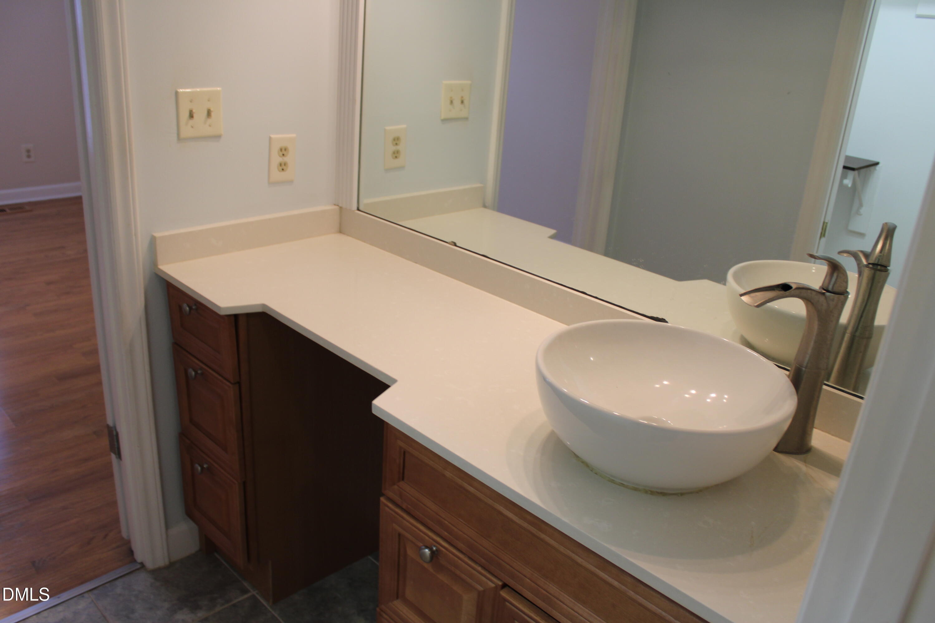 6701 Queen Annes Drive Raleigh, NC 27613 - Photo 15 of 23 a bathroom with a sink a toilet and mirror
