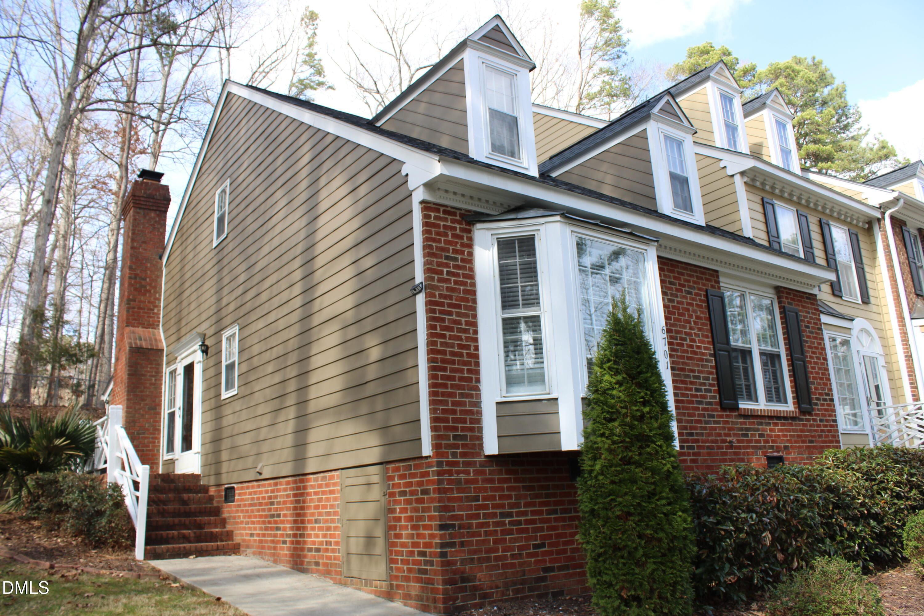 6701 Queen Annes Drive Raleigh, NC 27613 - Photo 2 of 23 a view of a white house with a large windows
