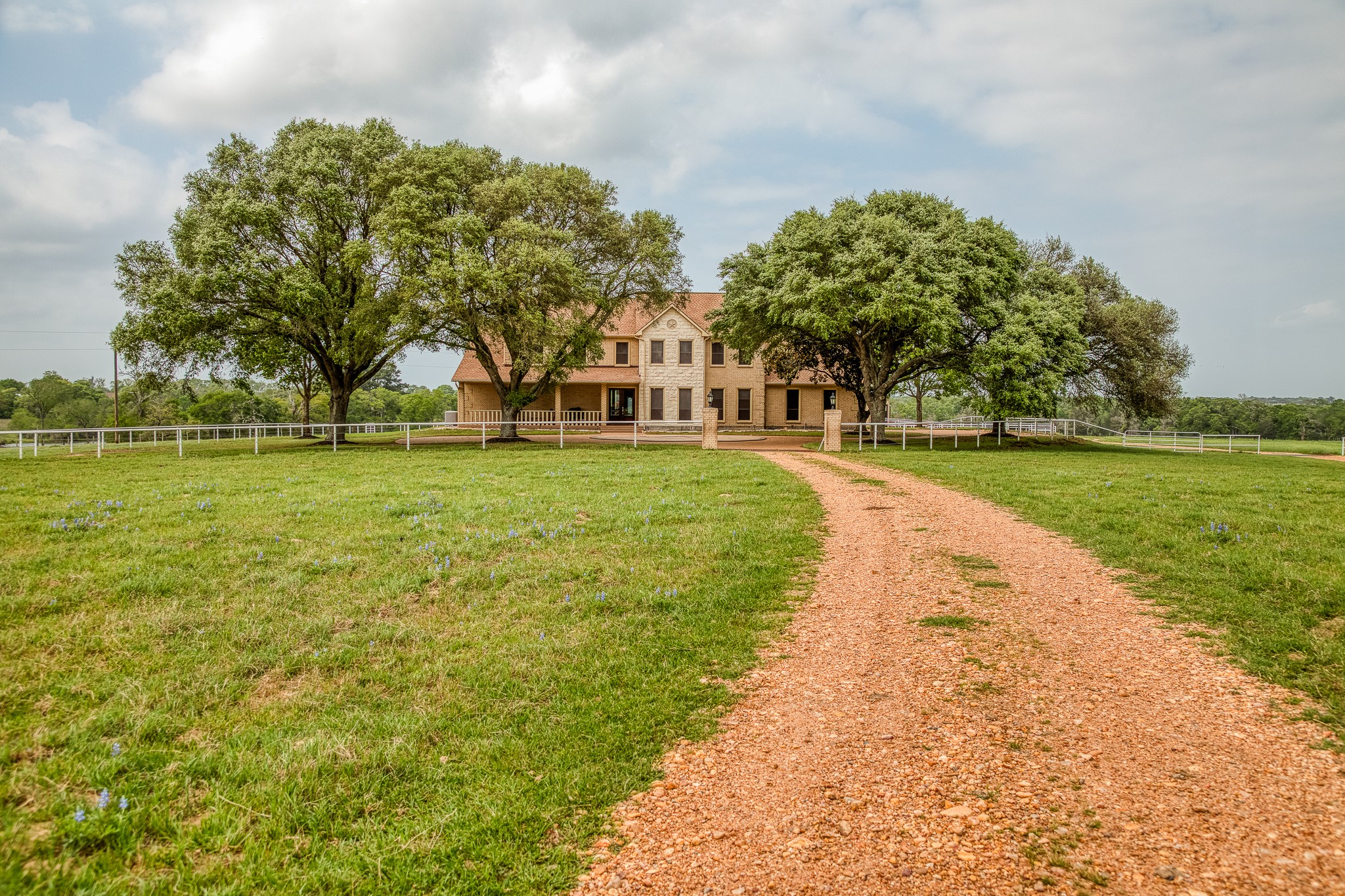 2204 Carter Road Bellville, TX 77418 - Photo 1 of 30 a view of a swimming pool and trees in the background