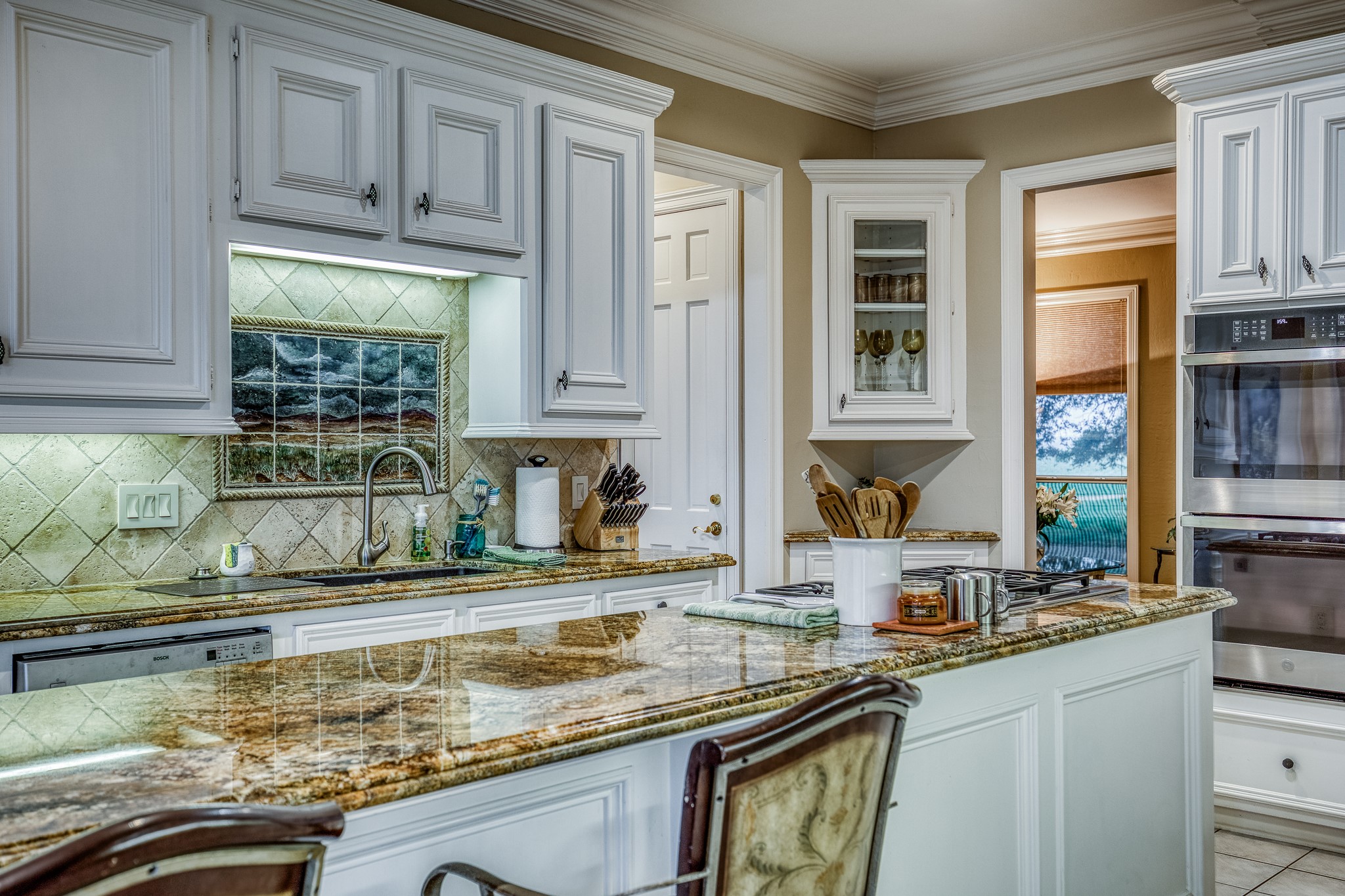 2204 Carter Road Bellville, TX 77418 - Photo 12 of 30 a kitchen with kitchen island granite countertop a sink a stove and cabinets