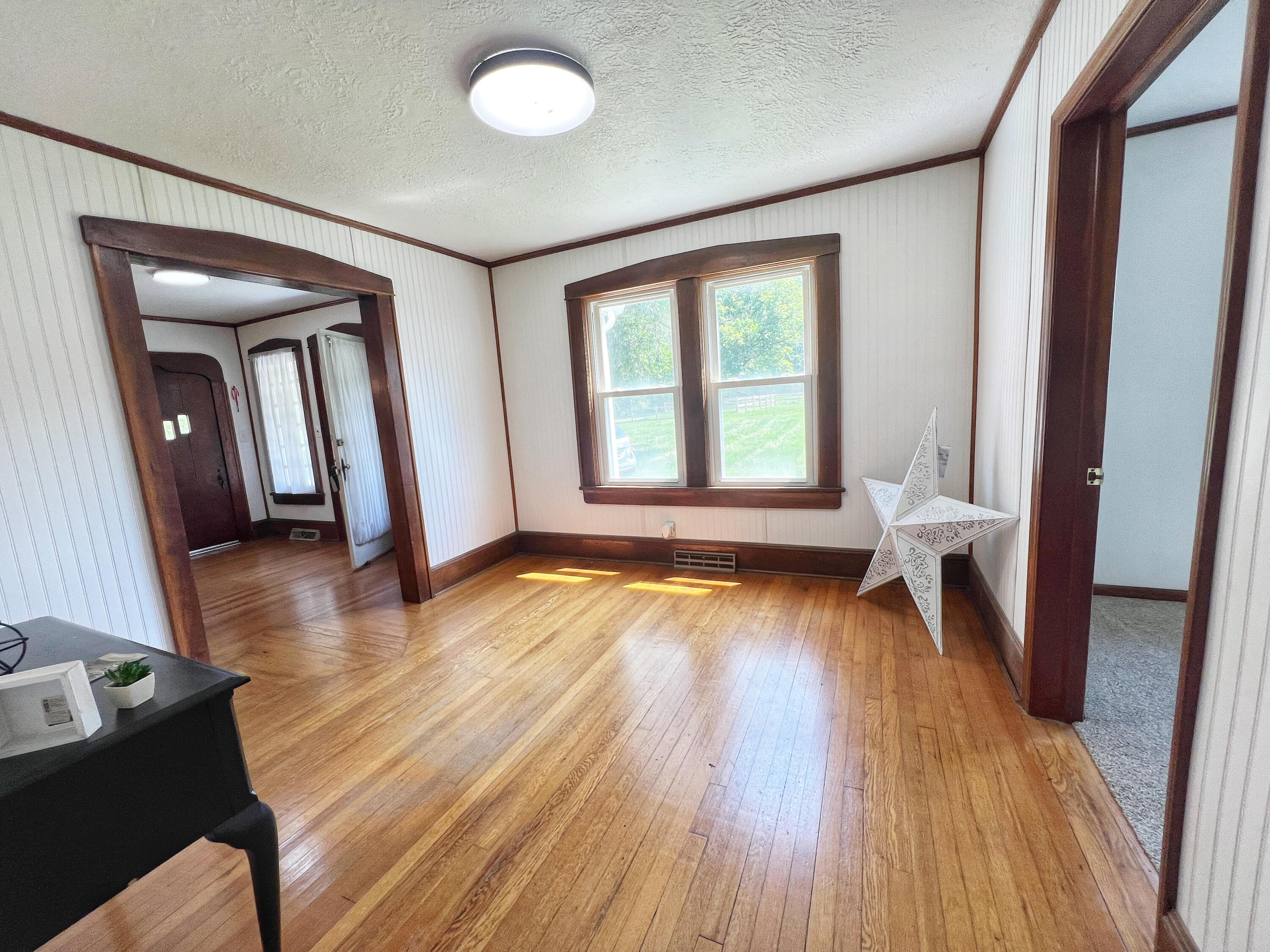 2827 Max Creek Road Hiwassee, VA 24347 - Photo 15 of 35 a view of an empty room with wooden floor and a window