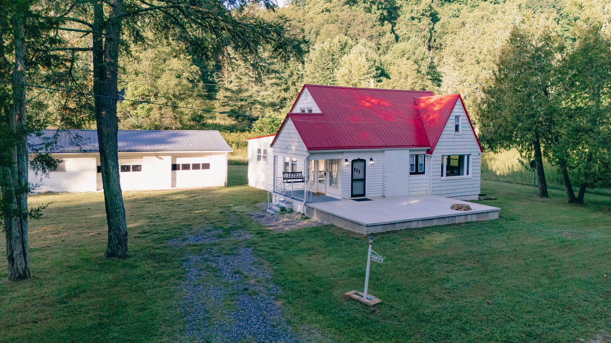 2827 Max Creek Road Hiwassee, VA 24347 - Photo 2 of 35 a view of a house with a backyard and a tree