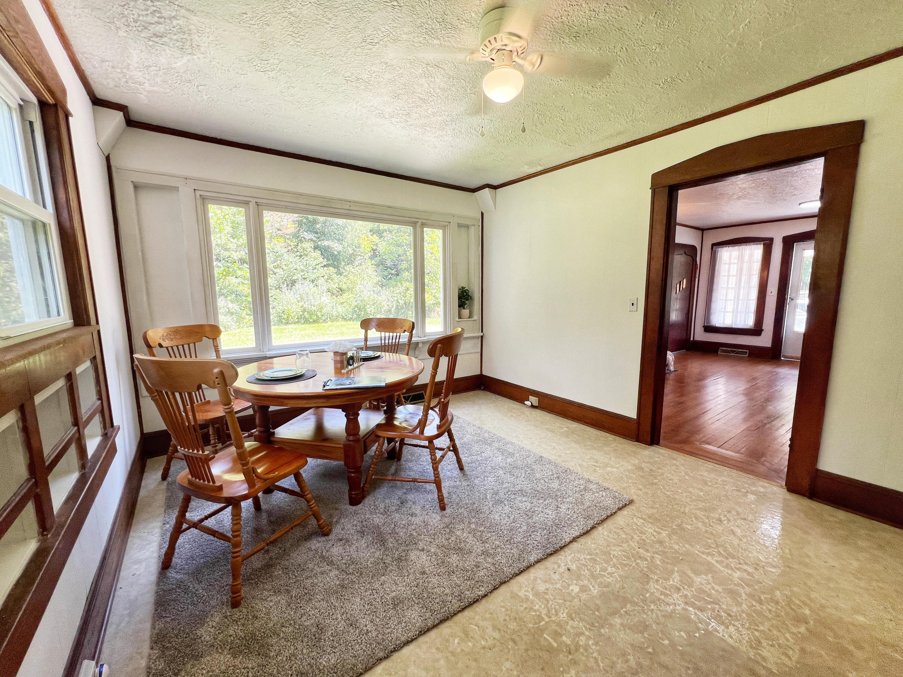 2827 Max Creek Road Hiwassee, VA 24347 - Photo 23 of 35 a view of a dining room with furniture window and wooden floor