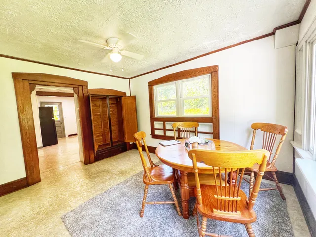 a dining room with furniture and window