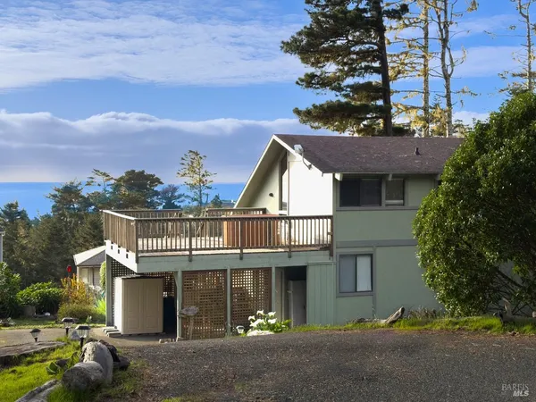 front view of a house with a garden