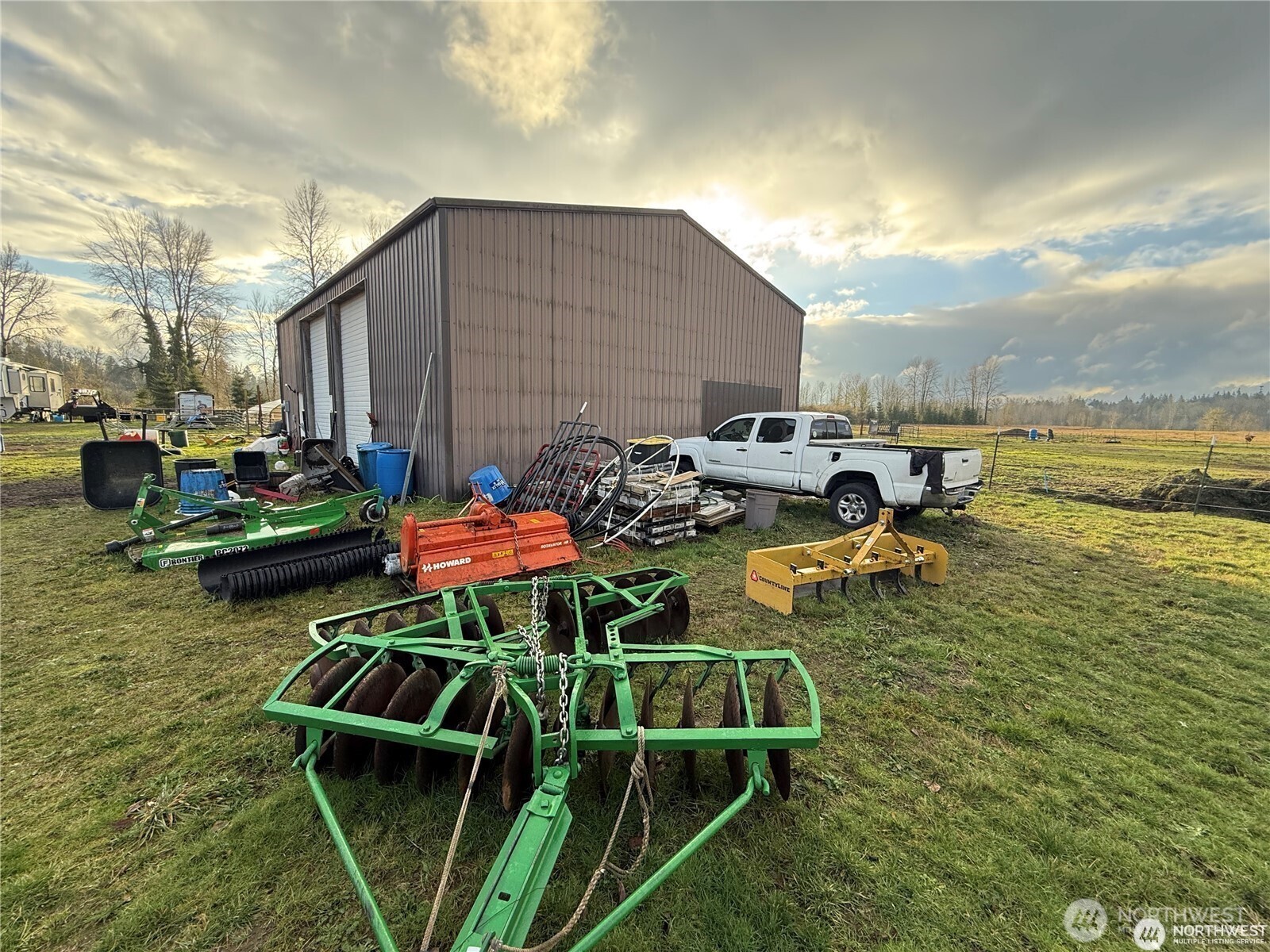 237 Collins Road Toledo, WA 98591 - Photo 13 of 25 a backyard of a house with table chairs and a fire pit
