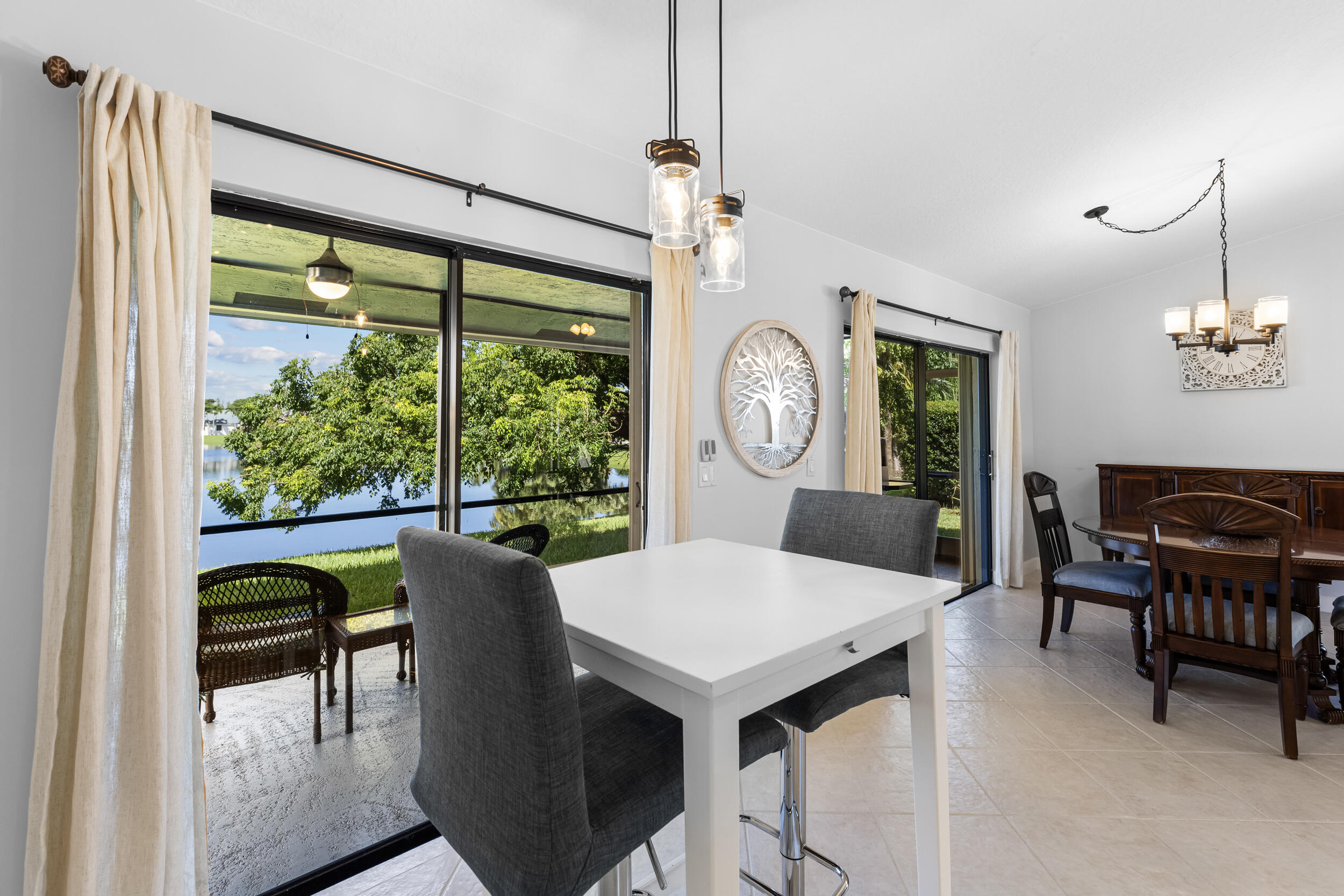 14451 Parker Ridge Court Delray Beach, FL 33484 - Photo 14 of 48 a view of a dining room with furniture window and outside view