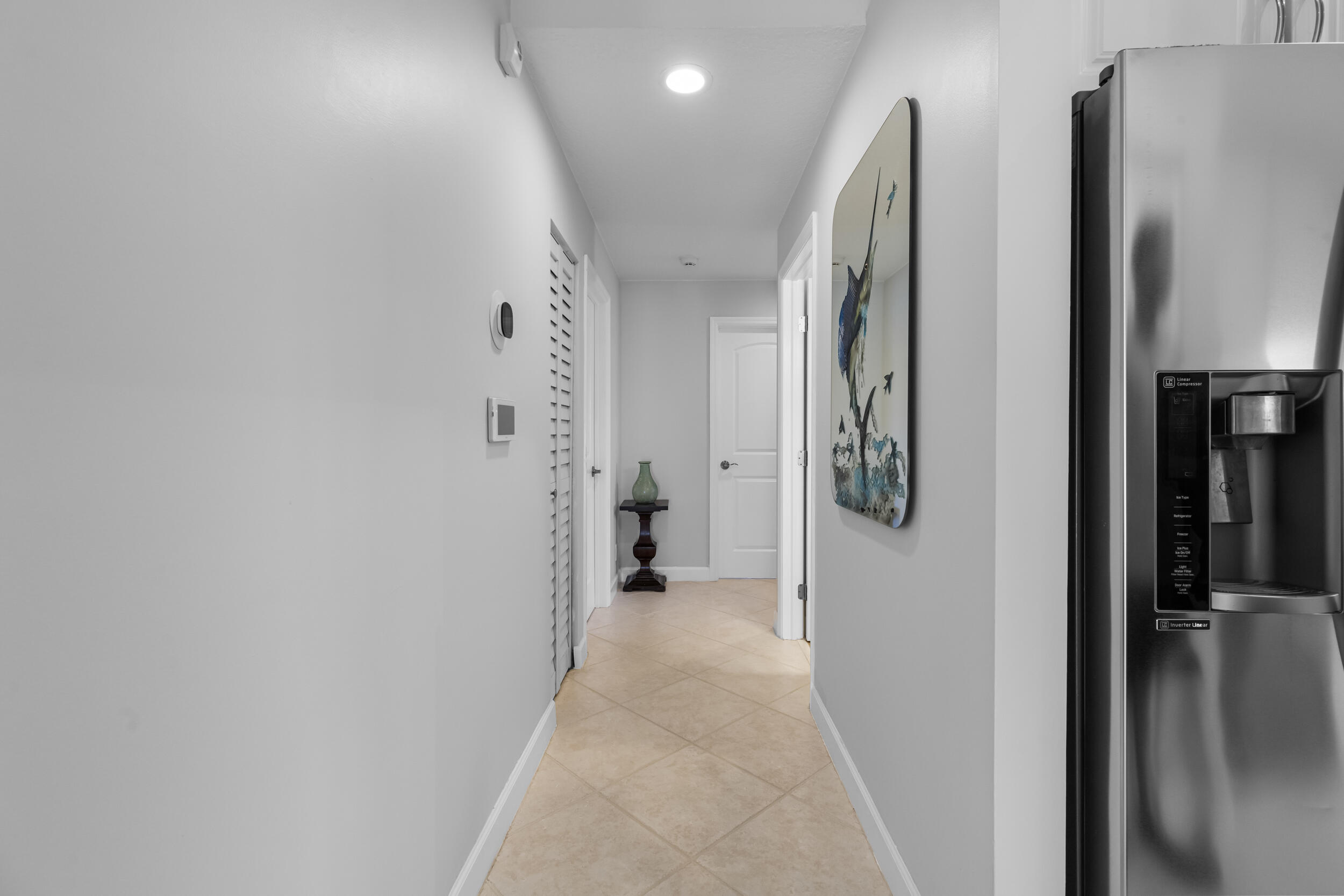 14451 Parker Ridge Court Delray Beach, FL 33484 - Photo 22 of 48 a view of a hallway with closet and a window