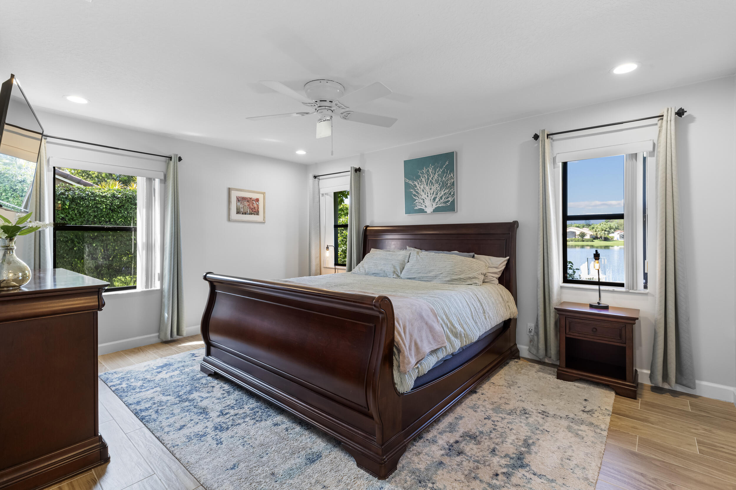 14451 Parker Ridge Court Delray Beach, FL 33484 - Photo 24 of 48 a bedroom with a bed lamp and a window