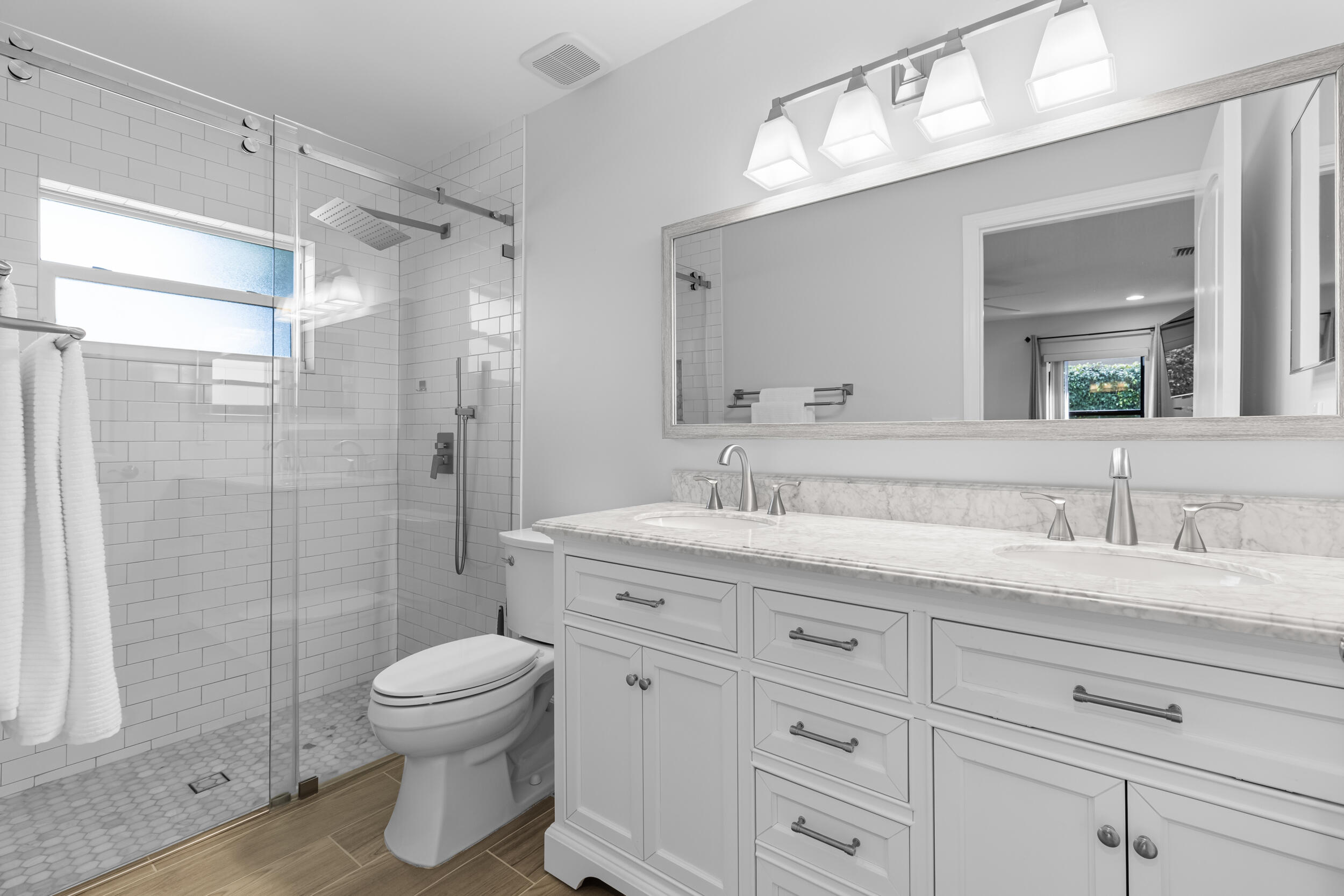14451 Parker Ridge Court Delray Beach, FL 33484 - Photo 27 of 48 a bathroom with a granite countertop sink a toilet and a shower