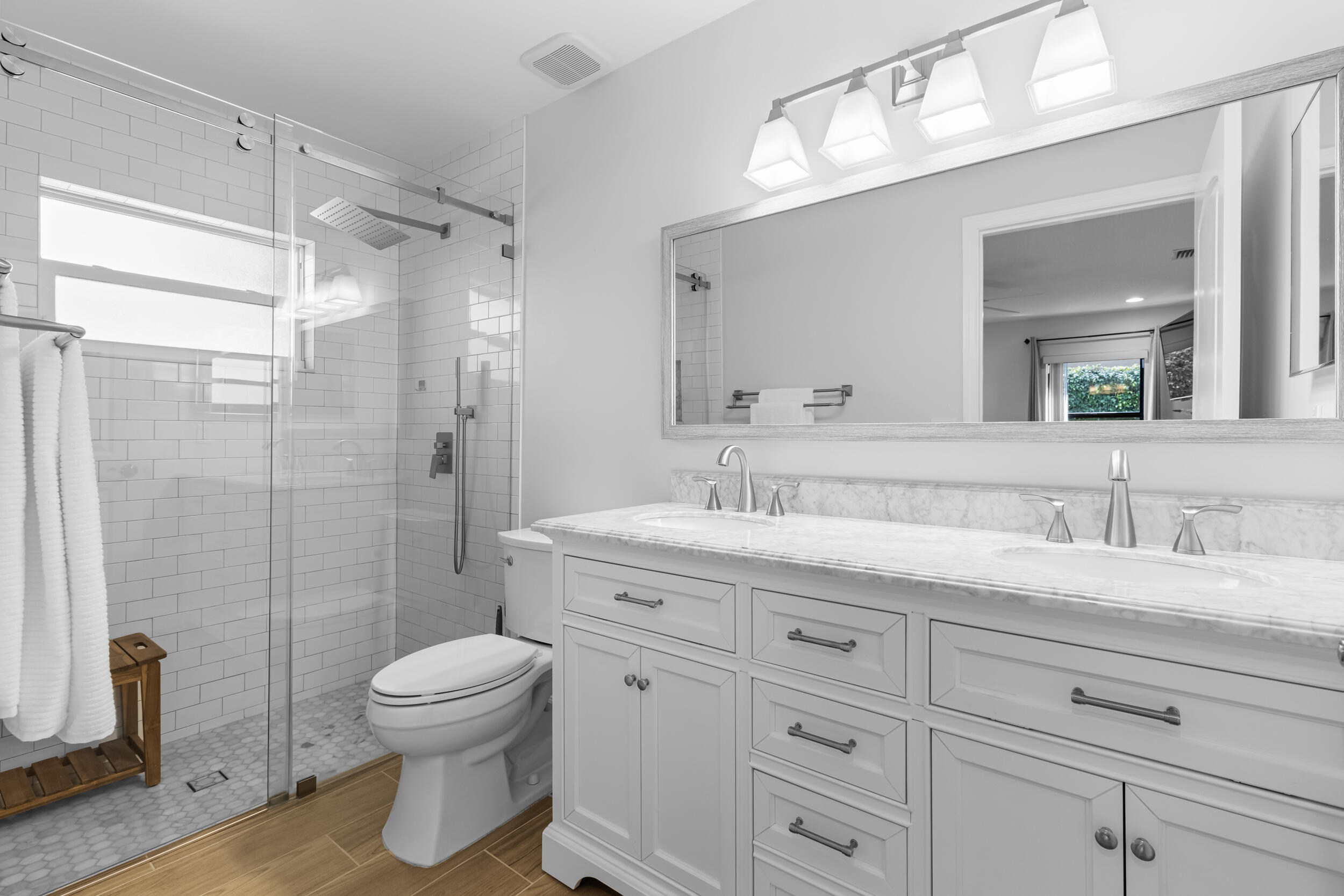 14451 Parker Ridge Court Delray Beach, FL 33484 - Photo 28 of 48 a bathroom with a granite countertop sink a toilet and a mirror
