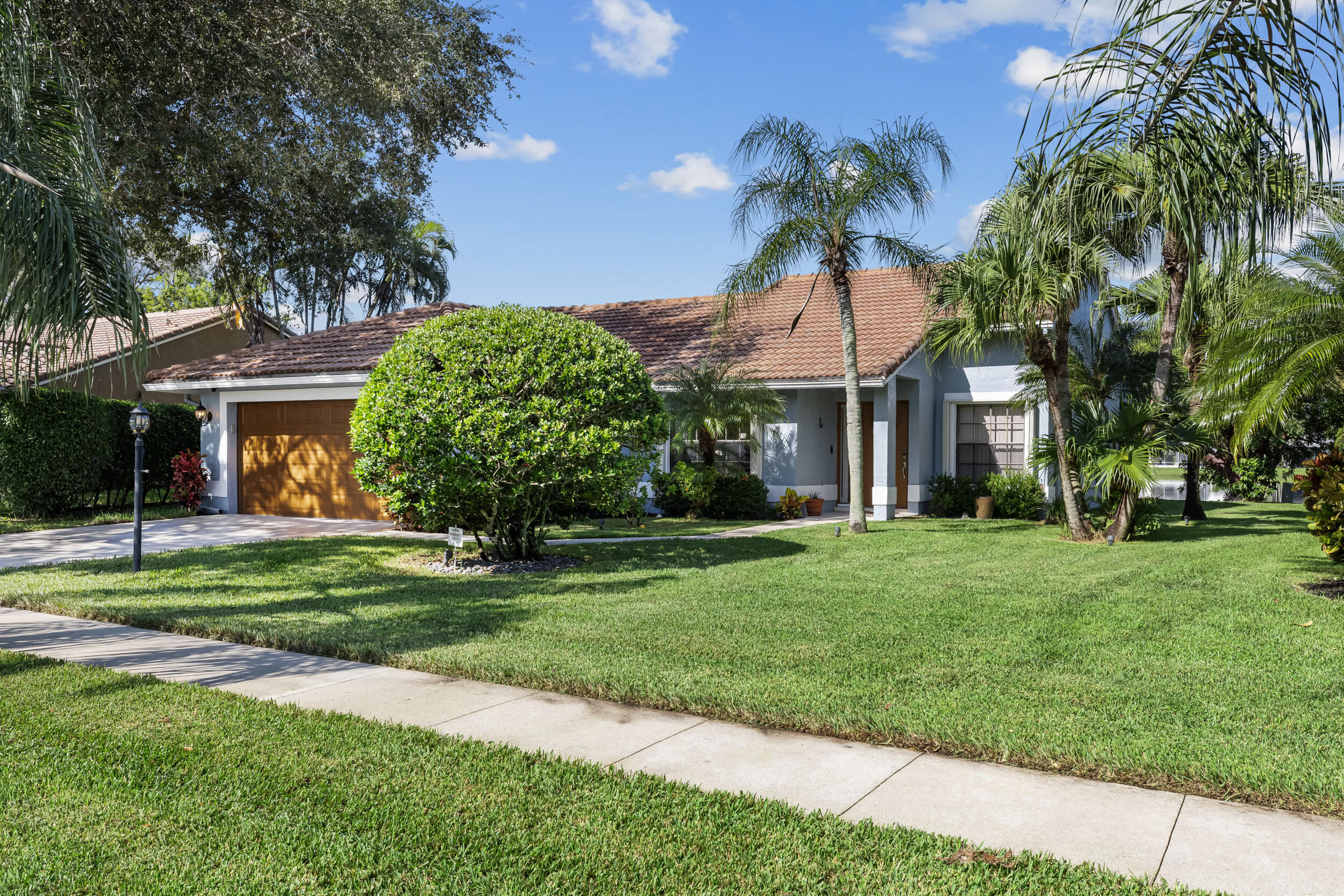 14451 Parker Ridge Court Delray Beach, FL 33484 - Photo 2 of 48 a view of a house with a yard