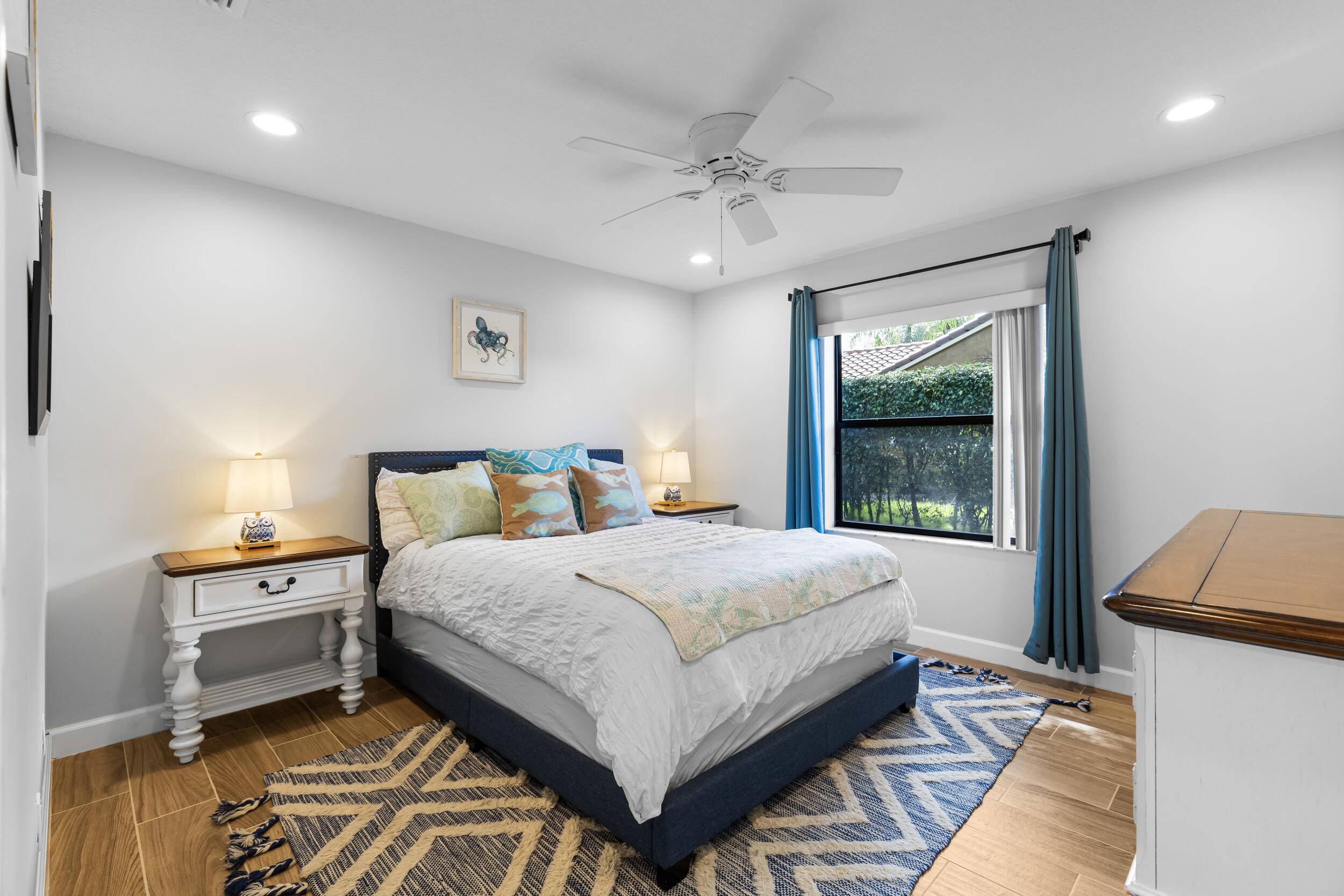 14451 Parker Ridge Court Delray Beach, FL 33484 - Photo 30 of 48 a bedroom with a bed and window