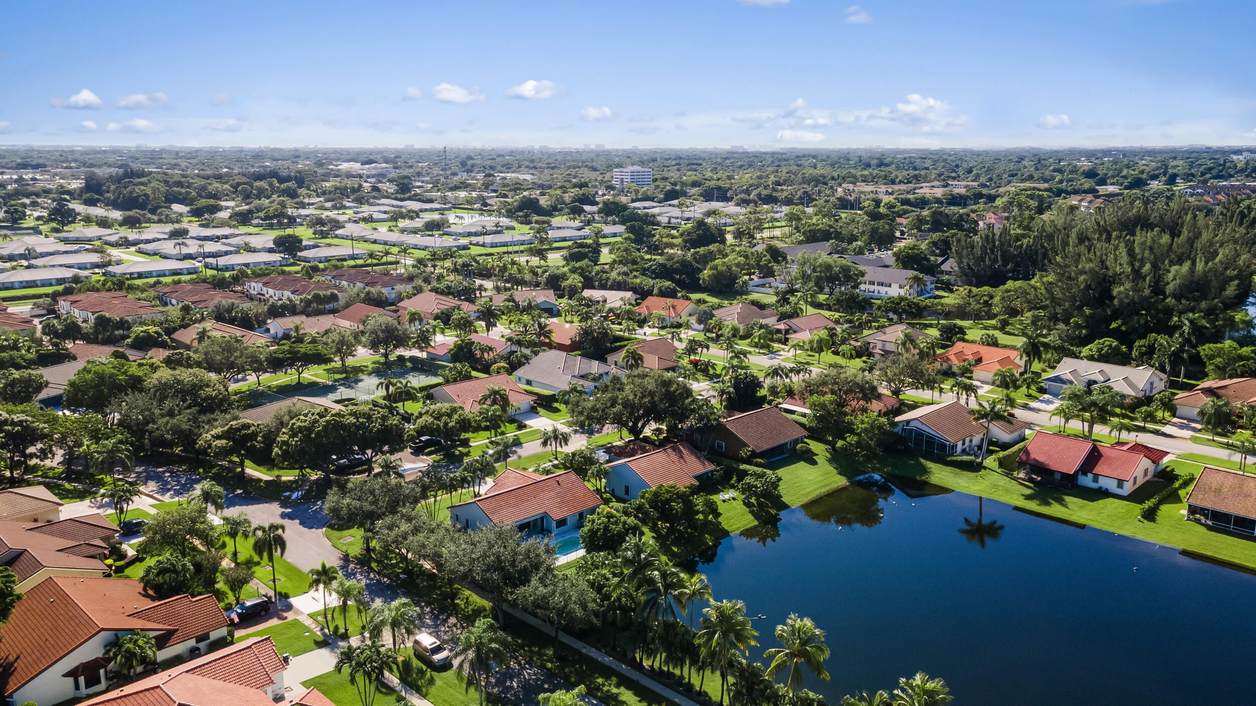 14451 Parker Ridge Court Delray Beach, FL 33484 - Photo 43 of 48 an aerial view of a city with lots of residential buildings