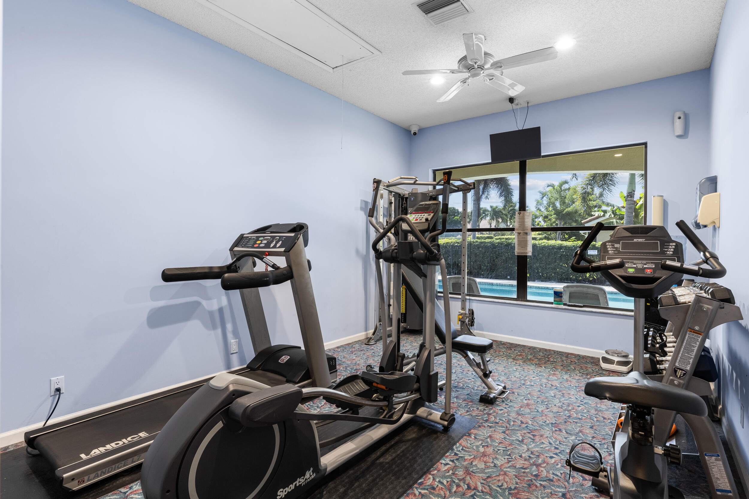 14451 Parker Ridge Court Delray Beach, FL 33484 - Photo 47 of 48 a view of a room with gym equipment