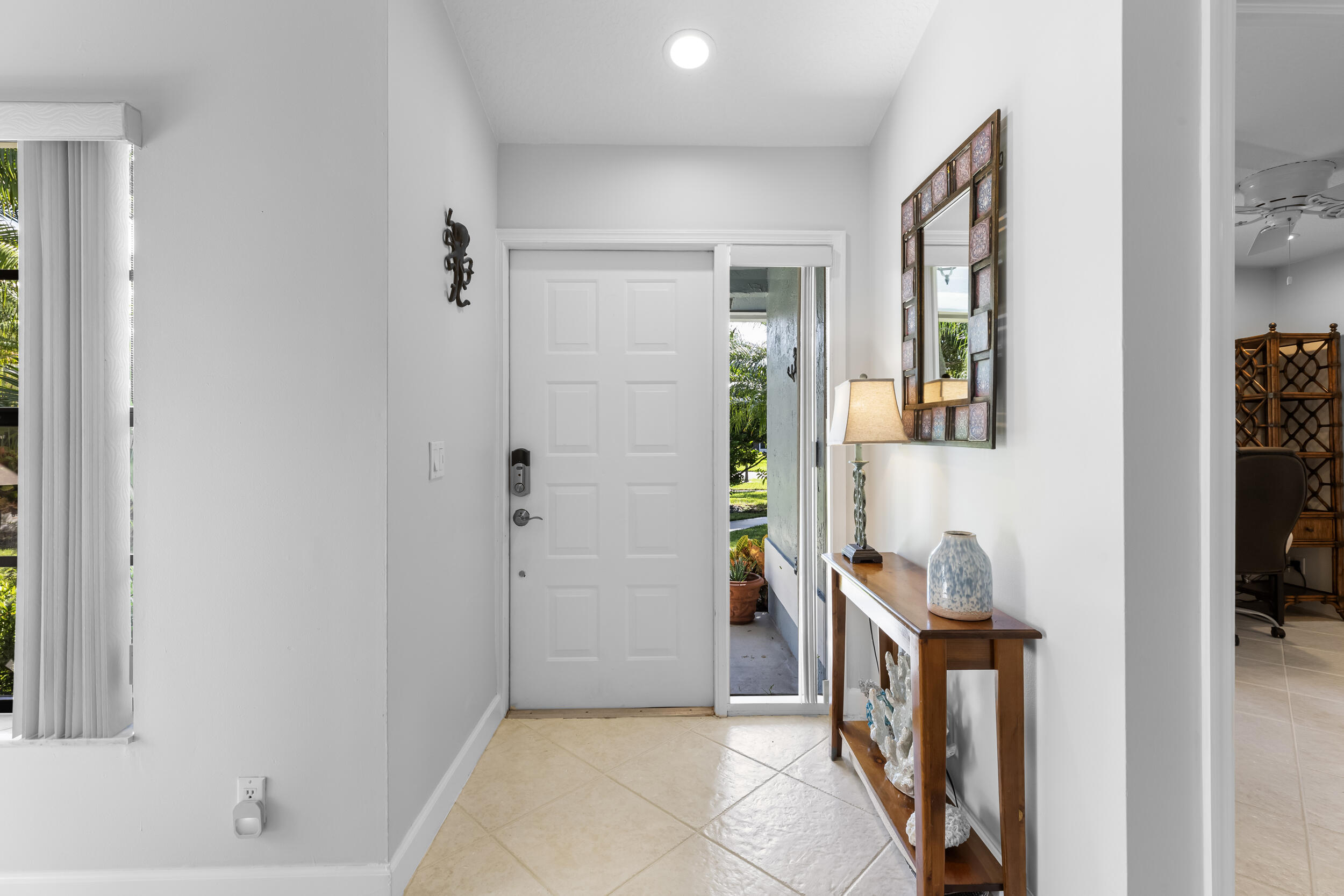 14451 Parker Ridge Court Delray Beach, FL 33484 - Photo 4 of 48 a view of hallway with livingroom and bedroom