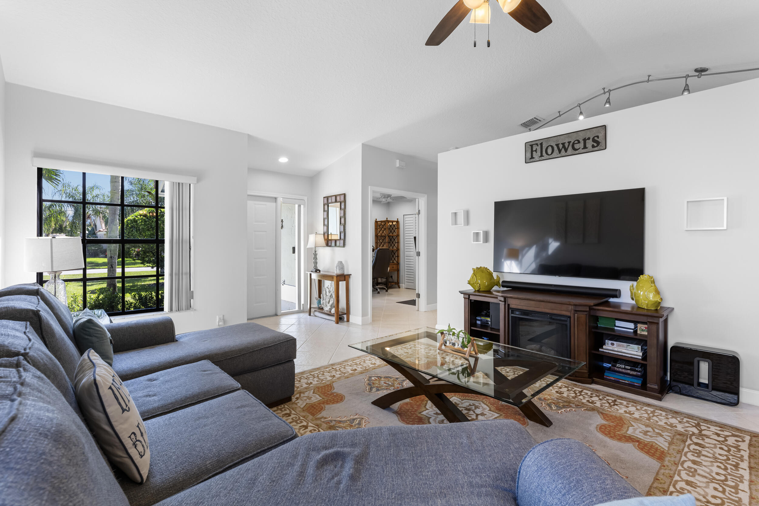 14451 Parker Ridge Court Delray Beach, FL 33484 - Photo 9 of 48 a living room with furniture and a flat screen tv