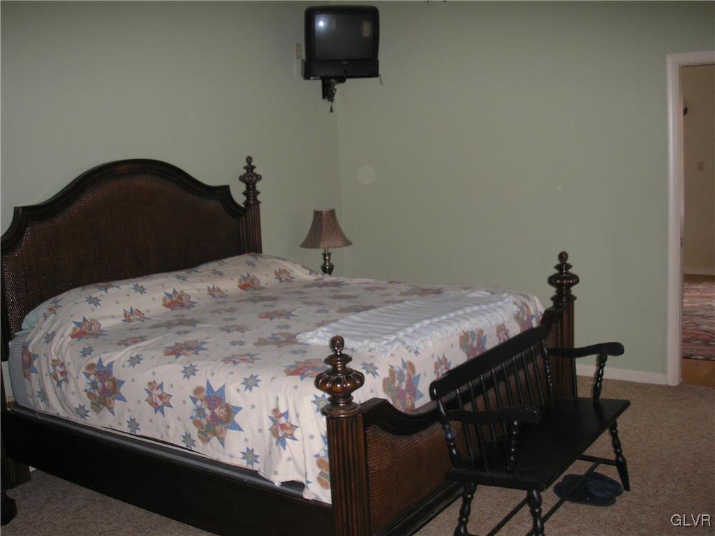5785 Haasadahl Road Orefield, PA 18069 - Photo 11 of 28 a bedroom with a bed and chair