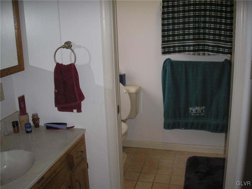 5785 Haasadahl Road Orefield, PA 18069 - Photo 12 of 28 a bathroom with a sink and a mirror