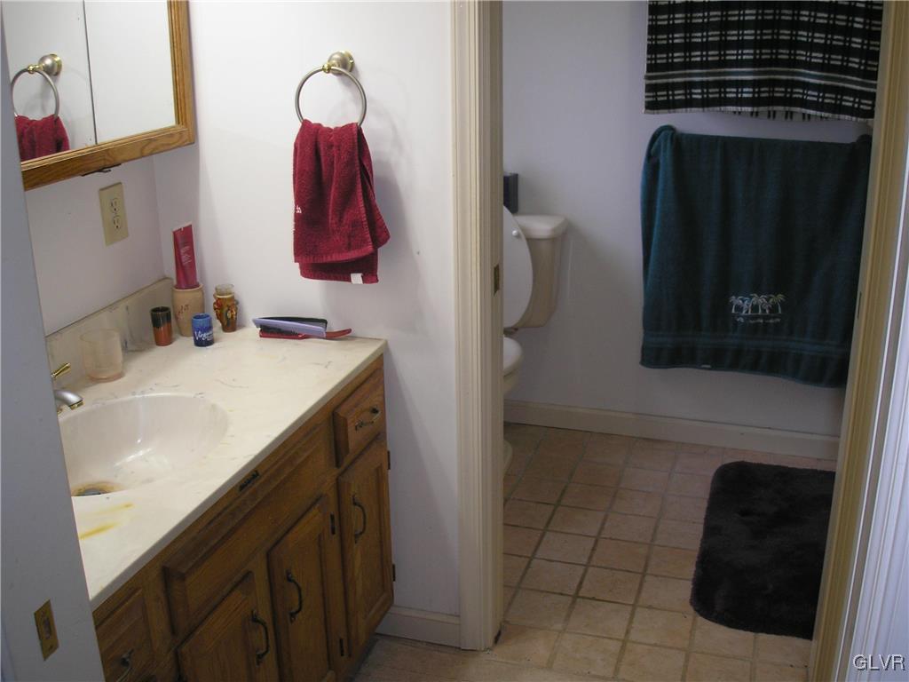 5785 Haasadahl Road Orefield, PA 18069 - Photo 13 of 28 a bathroom with a sink and a mirror