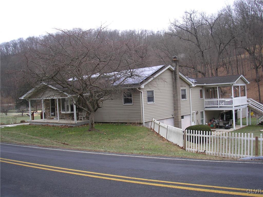 5785 Haasadahl Road Orefield, PA 18069 - Photo 2 of 28 a front view of a house with a garden
