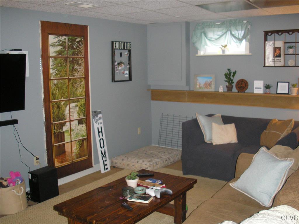 5785 Haasadahl Road Orefield, PA 18069 - Photo 23 of 28 a living room with furniture and a flat screen tv