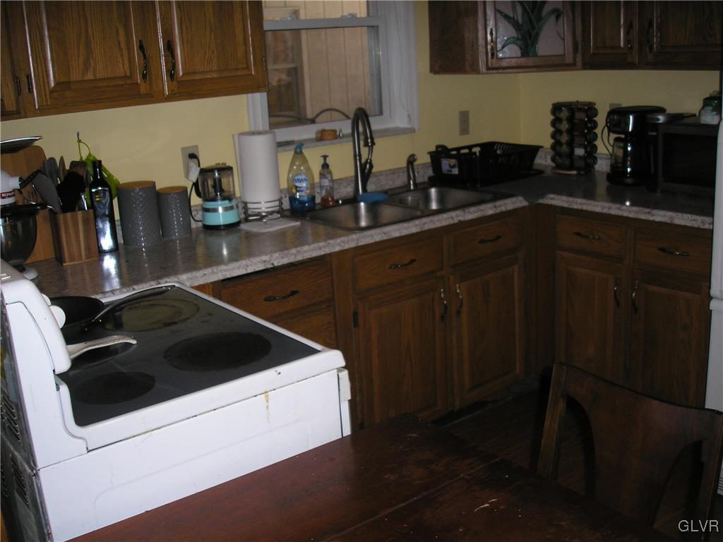 5785 Haasadahl Road Orefield, PA 18069 - Photo 24 of 28 a kitchen with a sink and cabinets