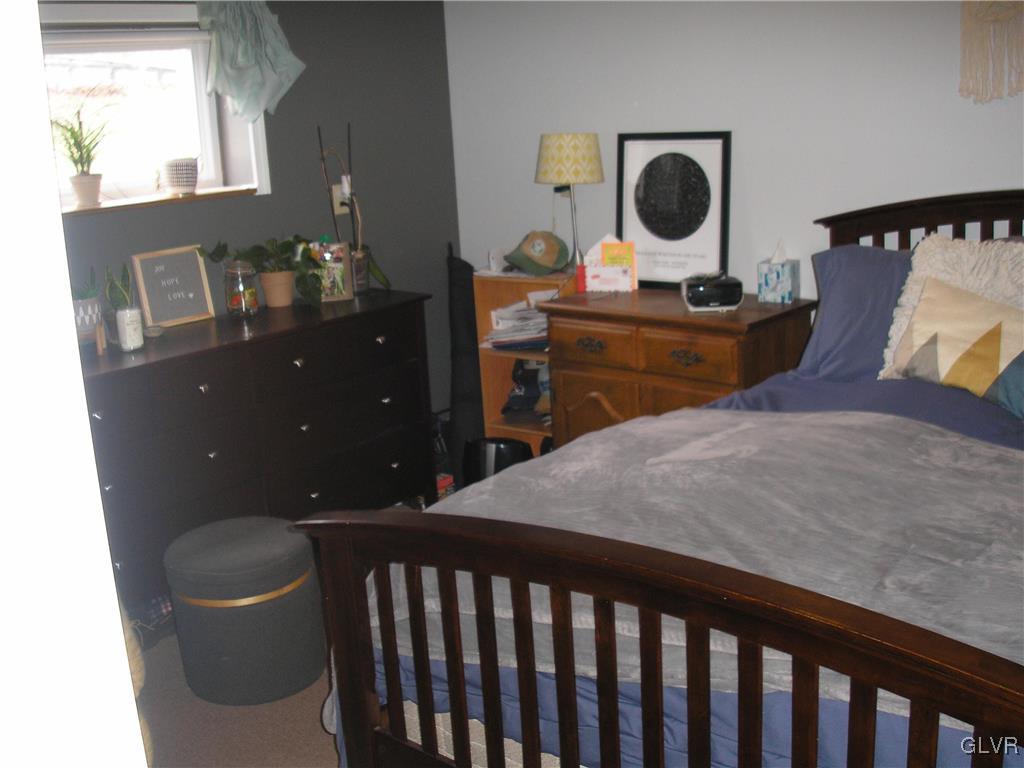 5785 Haasadahl Road Orefield, PA 18069 - Photo 25 of 28 a bedroom with a bed and a table