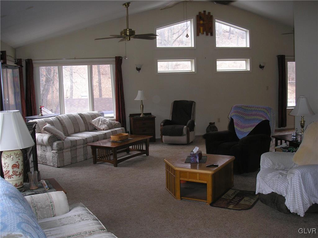 5785 Haasadahl Road Orefield, PA 18069 - Photo 6 of 28 a living room with furniture and a flat screen tv