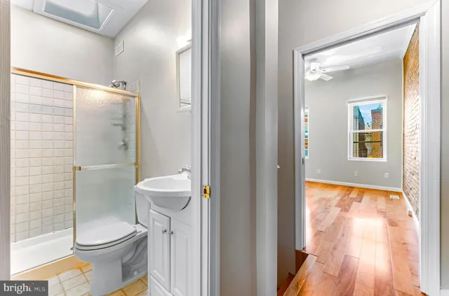 a view of empty room with a flat screen tv and front door