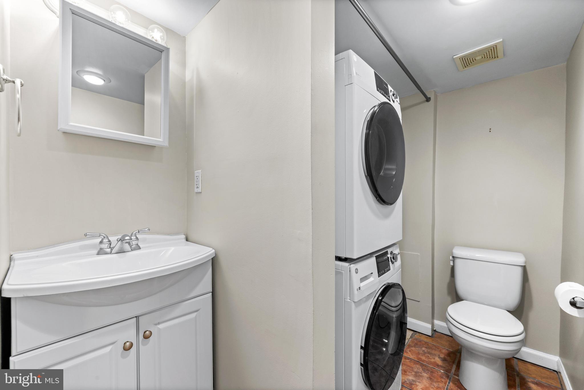 1432 Haubert Street Baltimore, MD 21230 - Photo 23 of 28 a bathroom with a sink mirror and toilet