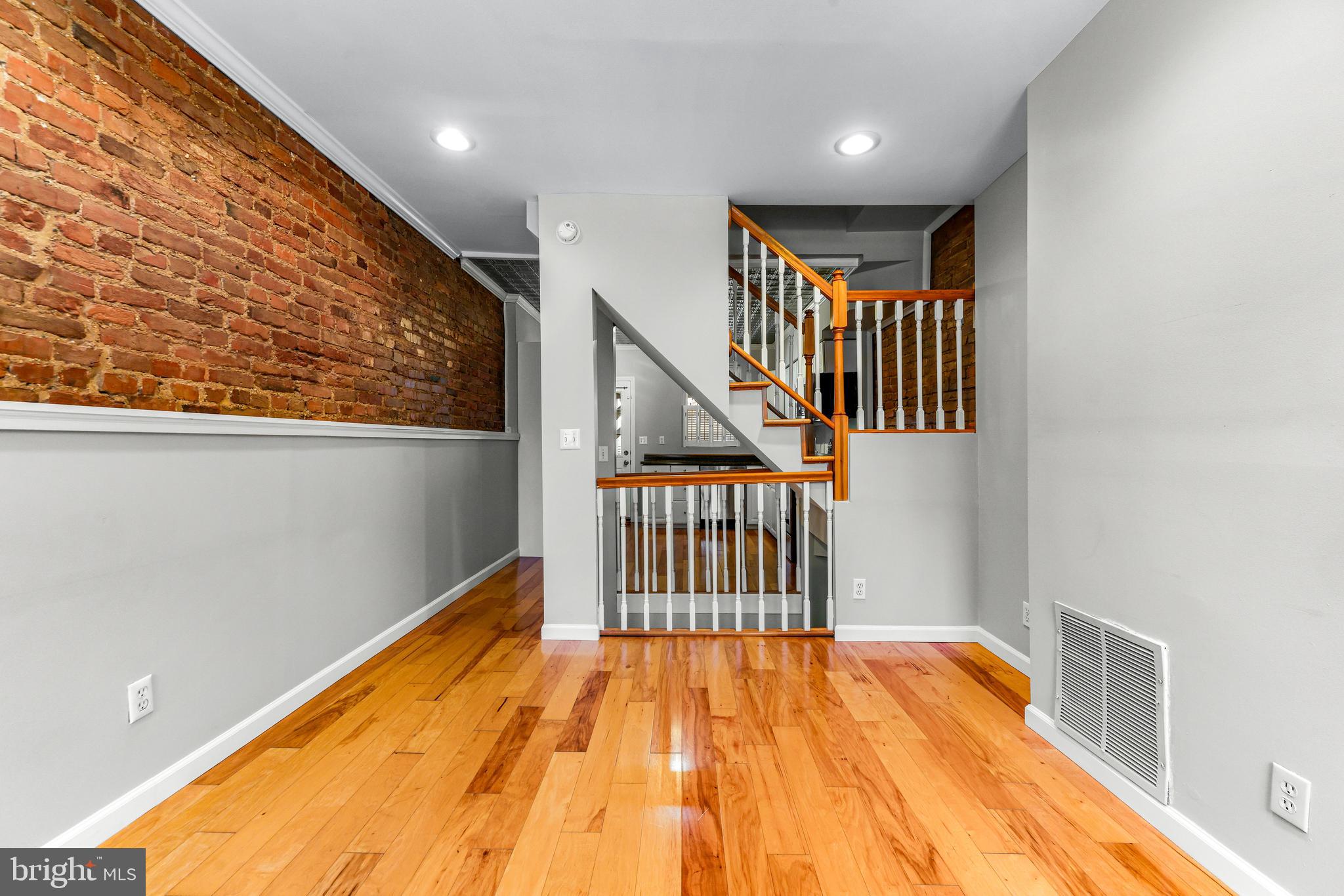 1432 Haubert Street Baltimore, MD 21230 - Photo 9 of 41 LR with open staircase and views into kitchen