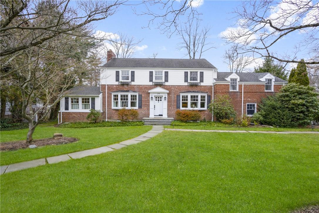 218 Mamaroneck Road Scarsdale, NY 10583 - Photo 1 of 1 a front view of a house with a yard and trees