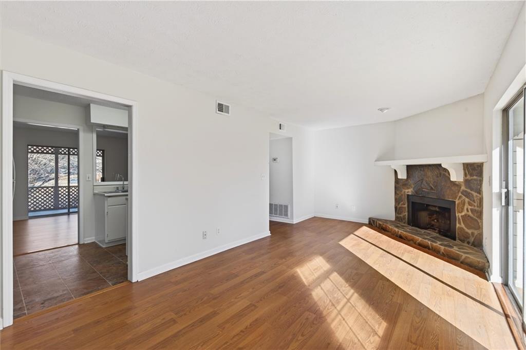 263 Quail Run Roswell, GA 30076 - Photo 17 of 47 a view of livingroom with flat screen tv and fireplace