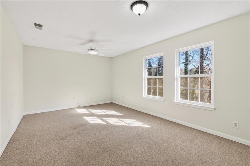 263 Quail Run Roswell, GA 30076 - Photo 28 of 47 an empty room with windows